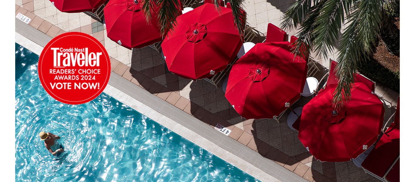 A Group Of Red Umbrellas Over A Pool